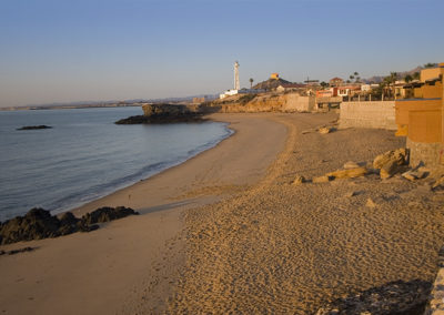 Still waters and sand in the early morning light