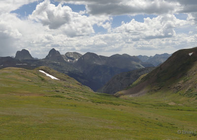 Pastoral view of distant mountains under threatening skies
