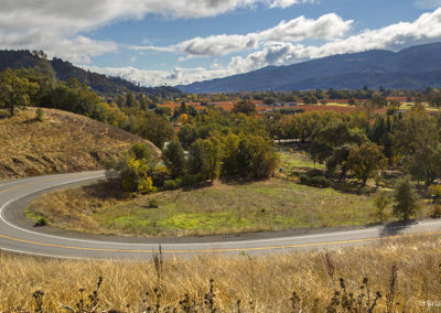 Country road winds into valley of colors